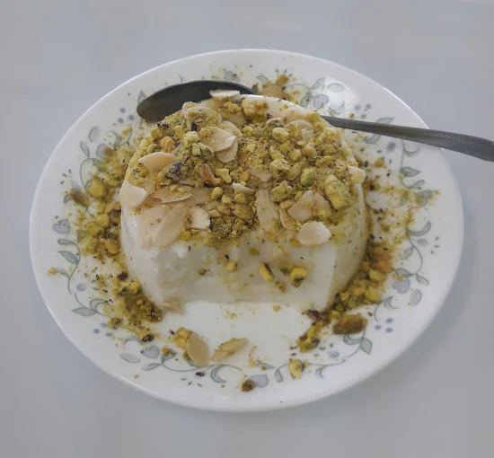 Beef donair platter with hummus and potato wedges at Empire Shawarma Calgary