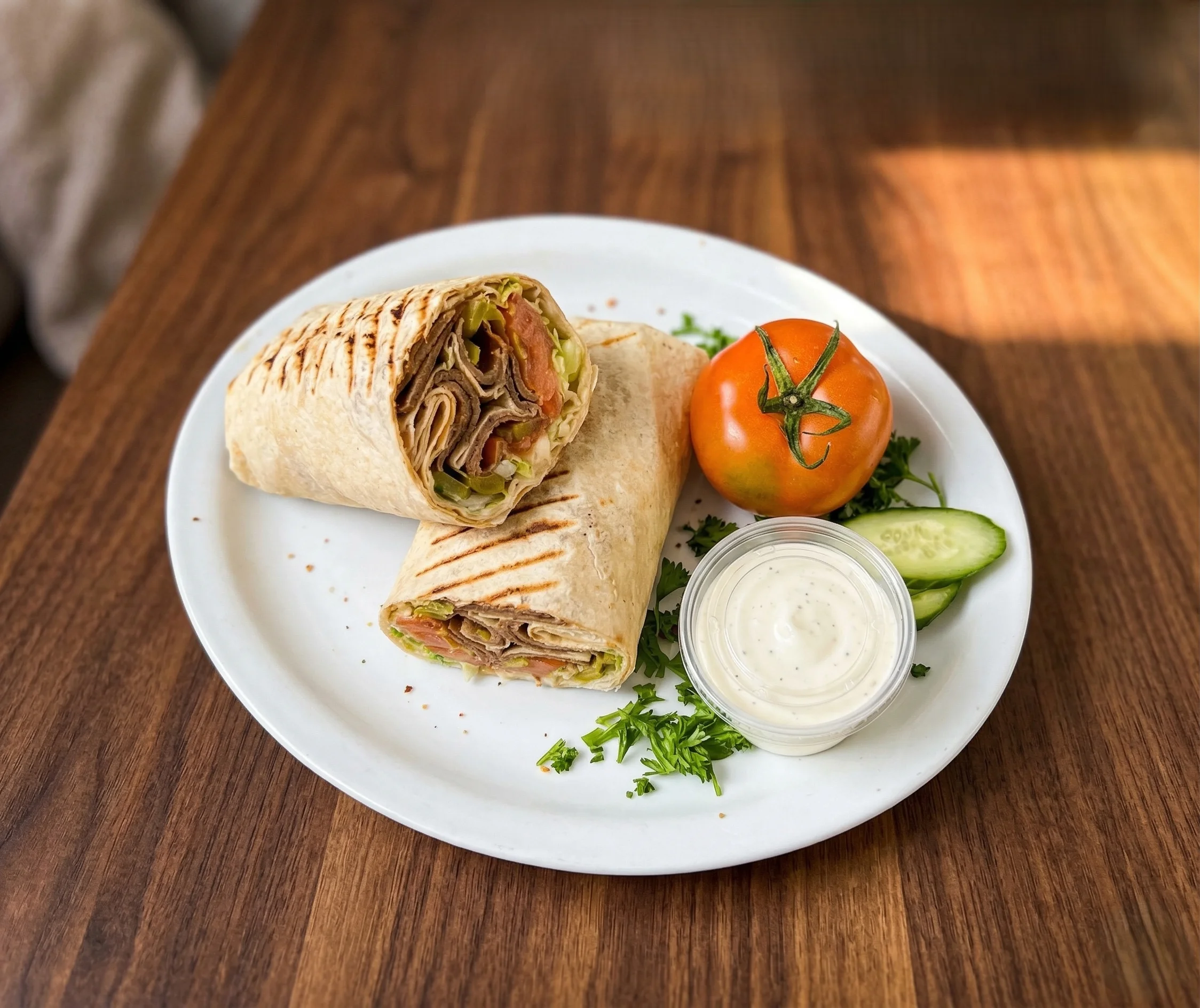Beef donair platter with rice and sauces at Empire Shawarma Calgary NW