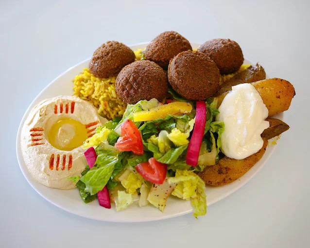 Crispy falafel platter with hummus and tahini at Empire Shawarma Calgary NW